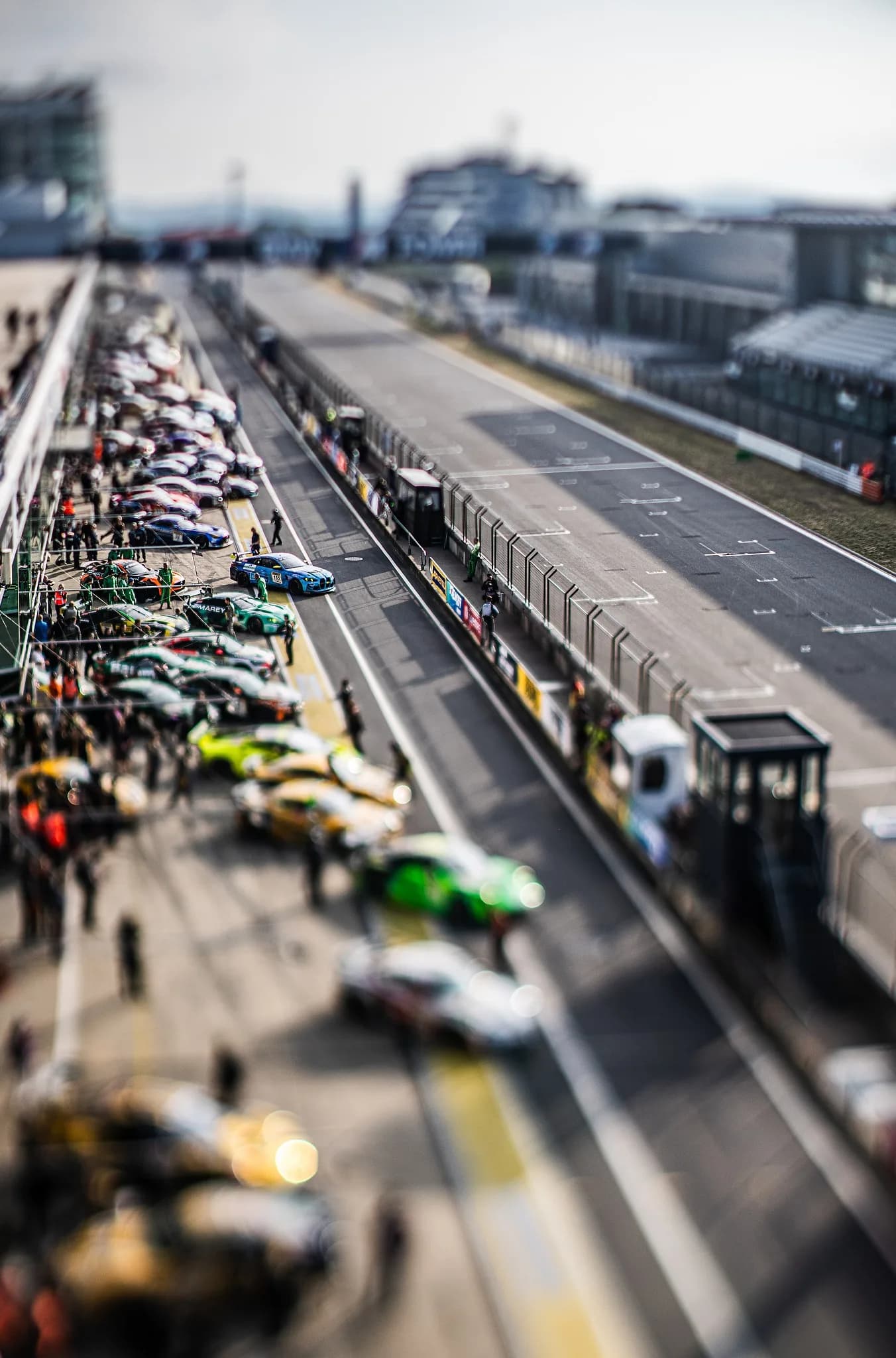 Toy Story - Miniature effect thanks to using tilt lens- paddock at iconic Nürburging.